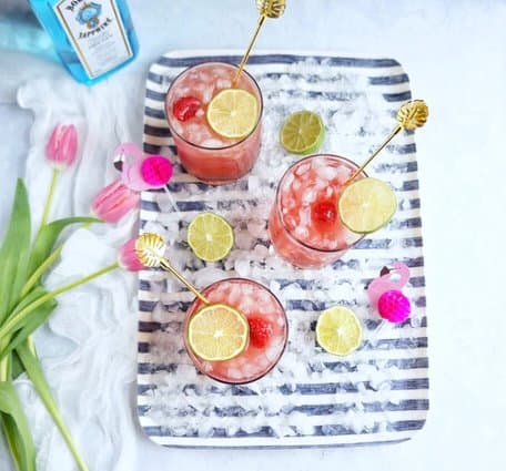 Kick up your feet, invite over some friends, and serve up these delicious raspberry smash cocktails.