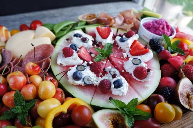 close up shot of watermelon pizza on fruit charcuterie board