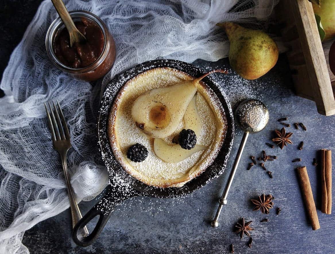 dutch baby pancake dutch baby pancake with poached pear and powdered sugar