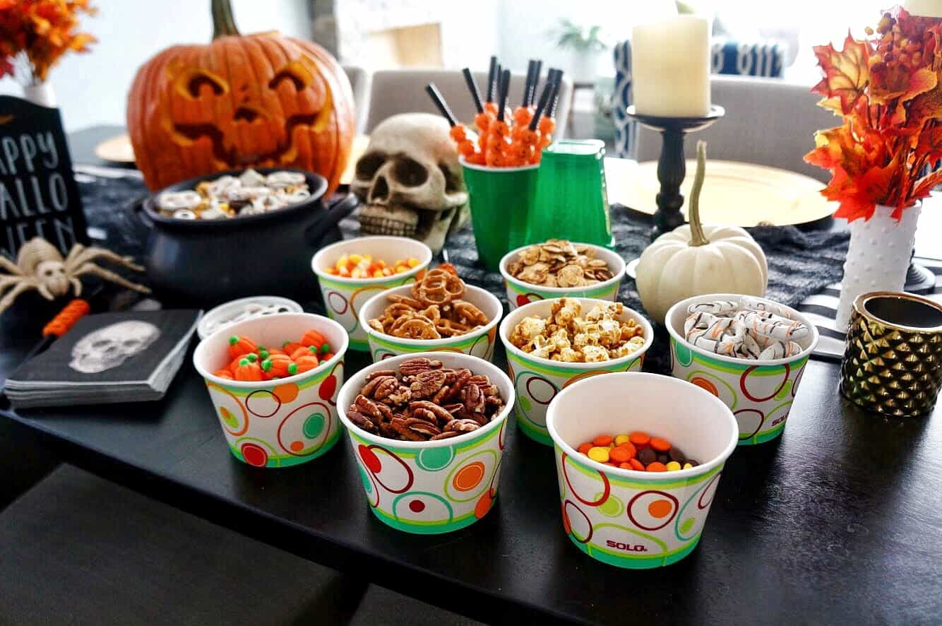 Halloween Trail Mix | Delicious blend of salty and sweet, this recipe for Halloween Trail Mix is perfect for a Fall snack or Halloween party! trail mix ingredients in solo cups