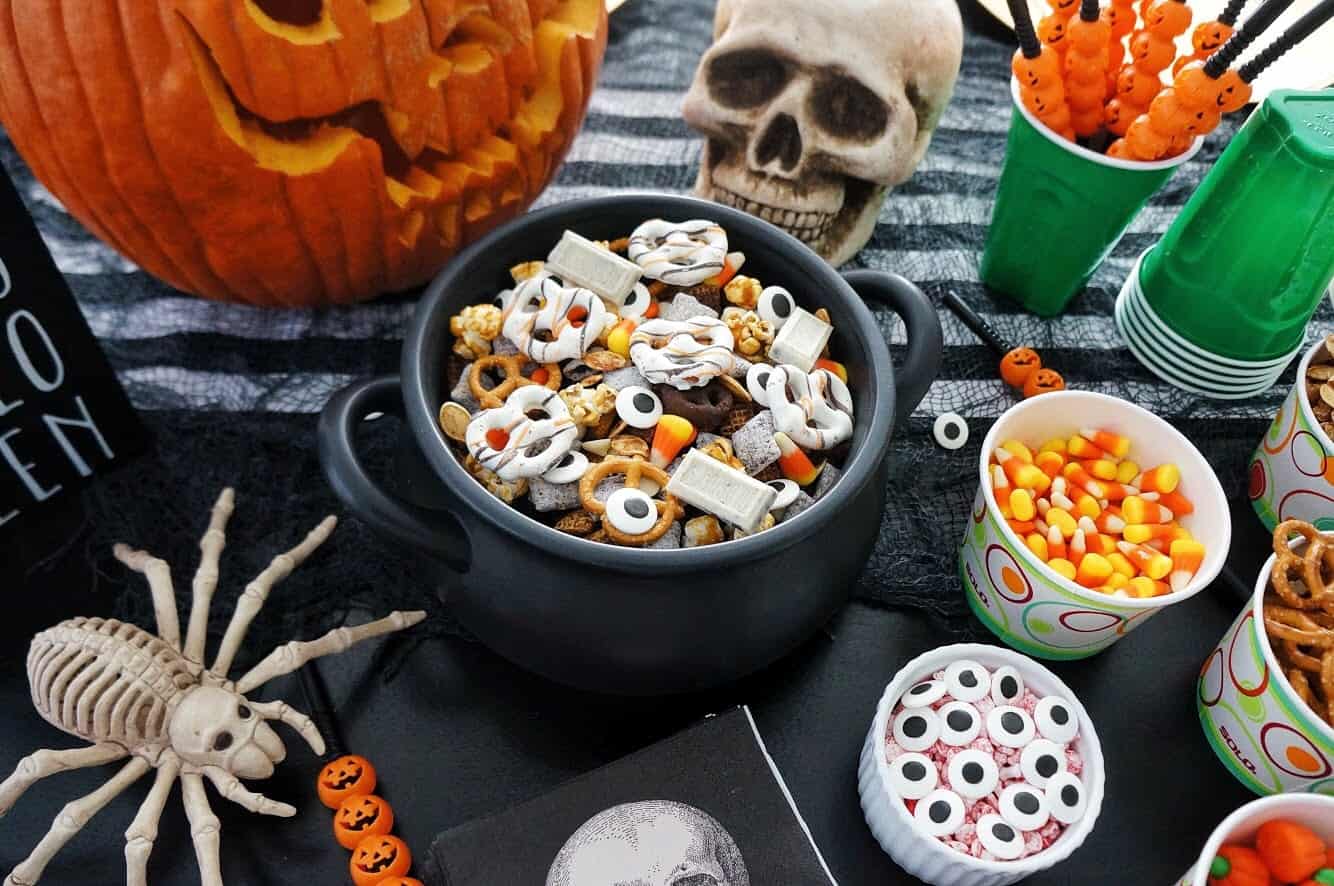 Halloween Trail Mix | Delicious blend of salty and sweet, this recipe for Halloween Trail Mix is perfect for a Fall snack or Halloween party! trail mix in black cauldron