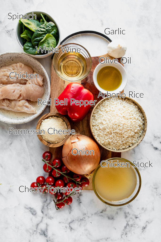 Instant pot cherry tomato risotto ingredients in individual bowls on a white marble background.