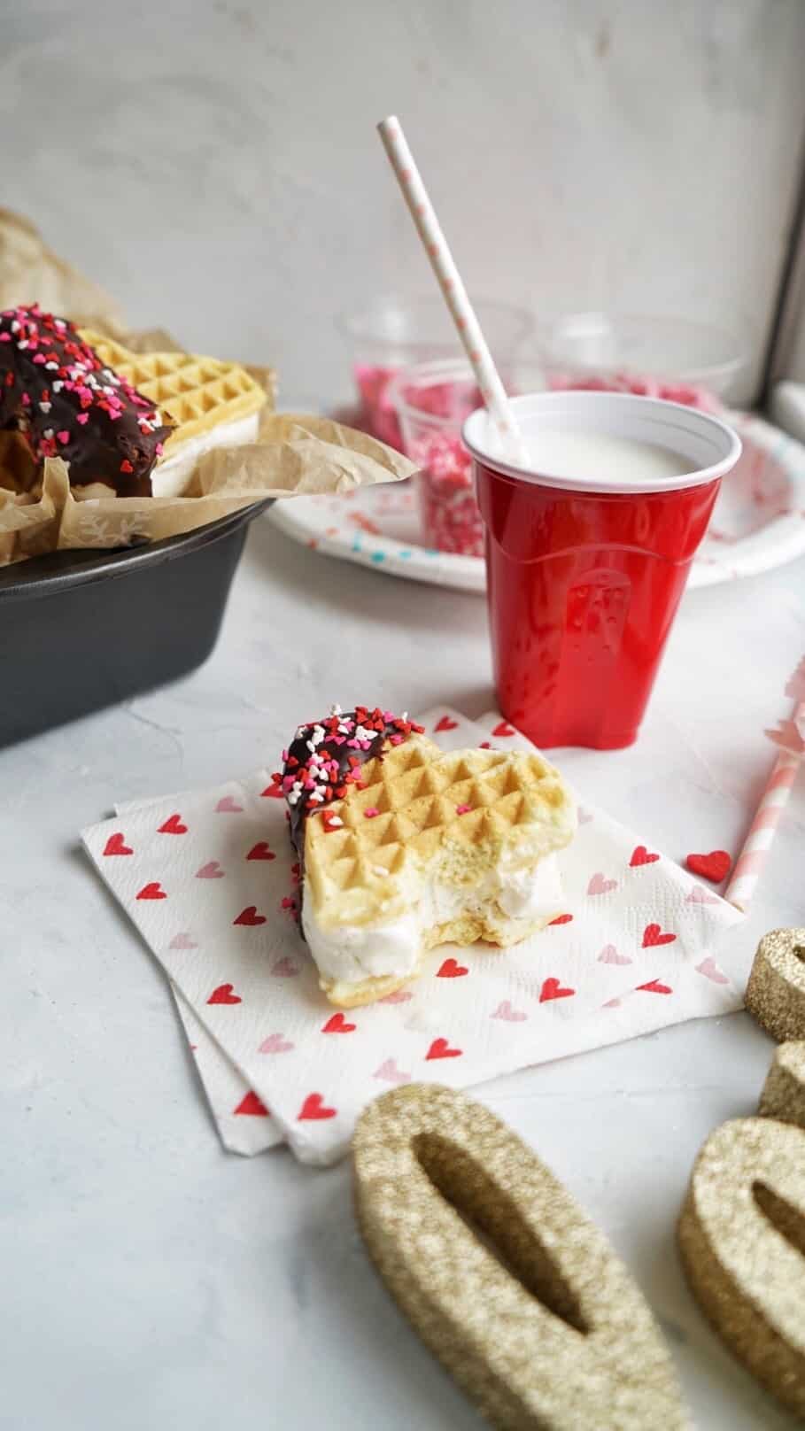 Waffle Ice Cream Sandwiches with bite taken Waffle Ice Cream Sandwiches
