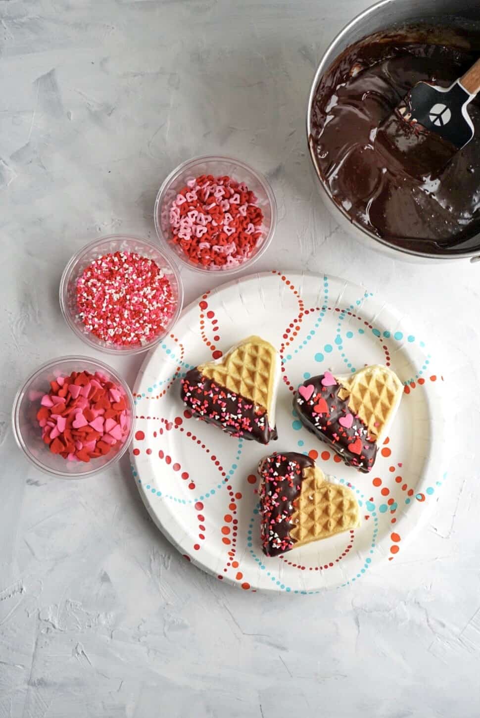 Waffle Ice Cream Sandwiches dipped in chocolate with sprinkles Waffle Ice Cream Sandwiches