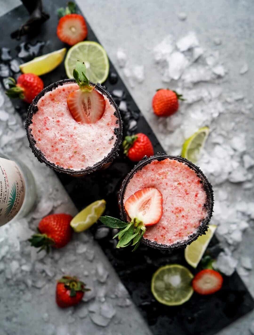 Strawberry Lime Margarita Strawberry Lime Margaritas on serving platter garnished with fresh strawberries and ice