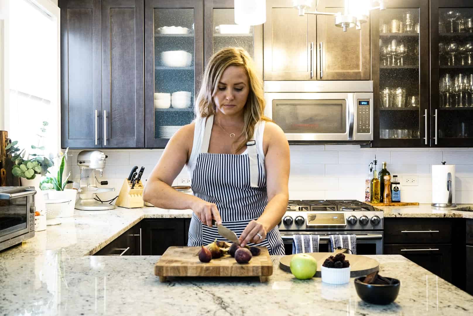 How to Make a Dessert Board Windy City Dinner Fairy prepping figs in the kitchen