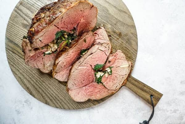 stuffed leg of lamb stuffed leg of lamb sliced on cutting board