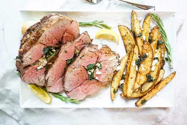 stuffed leg of lamb sliced stuffed leg of lamb with crispy potatoes