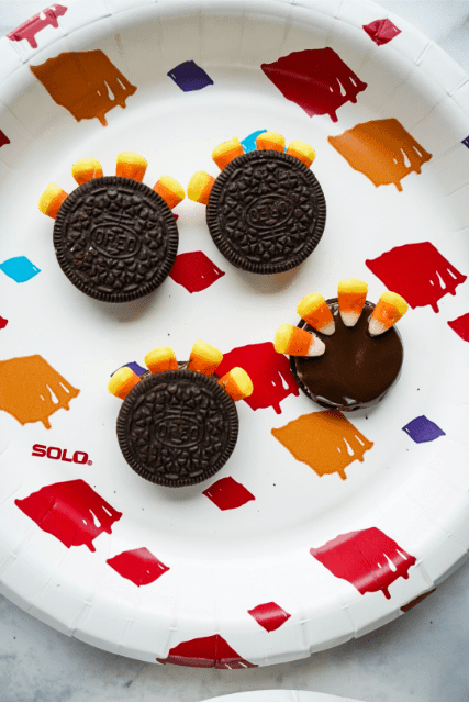double-stuffed turkey cookies putting the feathers on the double stuffed turkey cookie