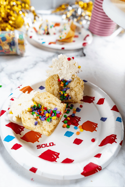 new year's eve confetti cupcake cut open with confetti inside