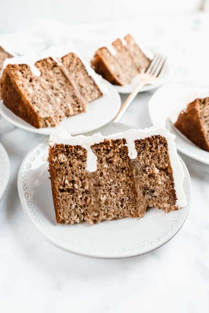 side shot of bananas foster cake sliced on plates