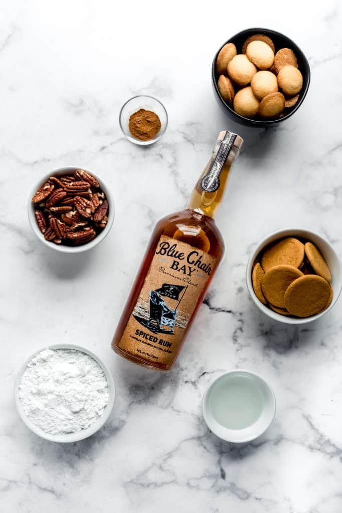 ginger spice rum ball ingredients in bowls on marble countertop