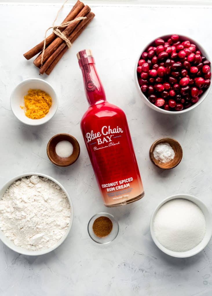 cranberry orange rum cake ingredients in bowls on white background