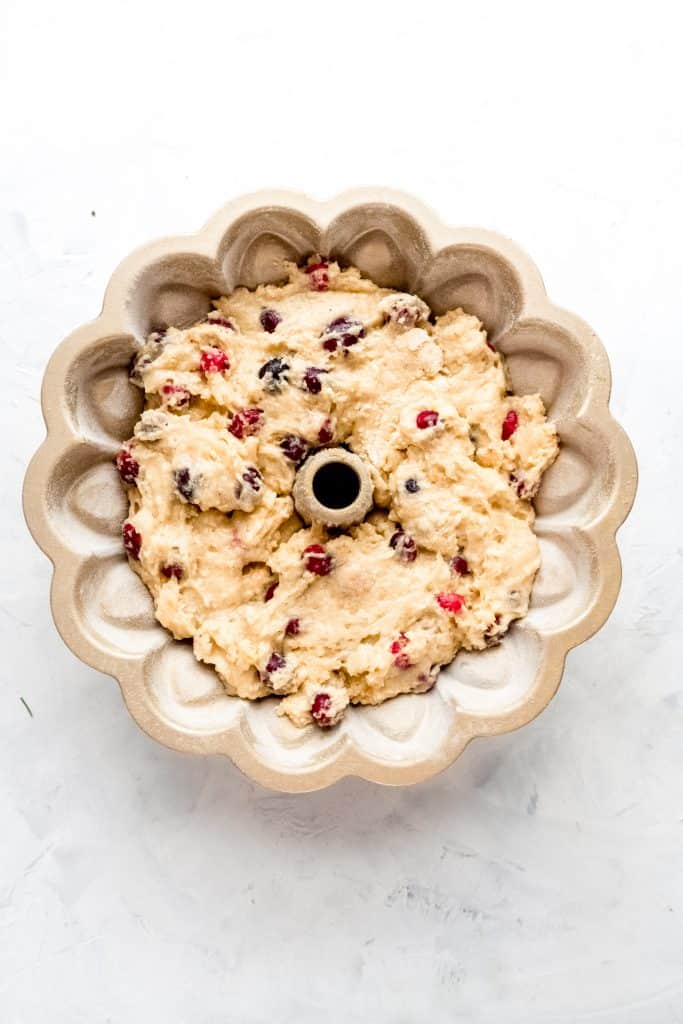 cranberry orange rum cake batter in bundt pan