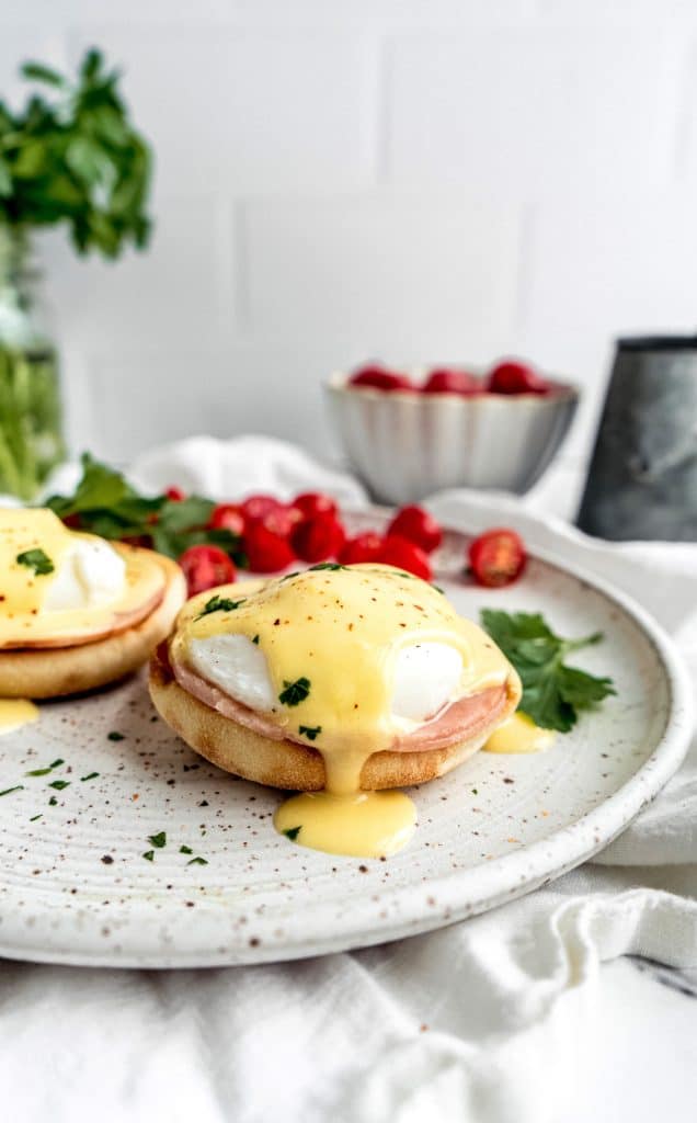 eggs benedict with citrus hollandaise on plate