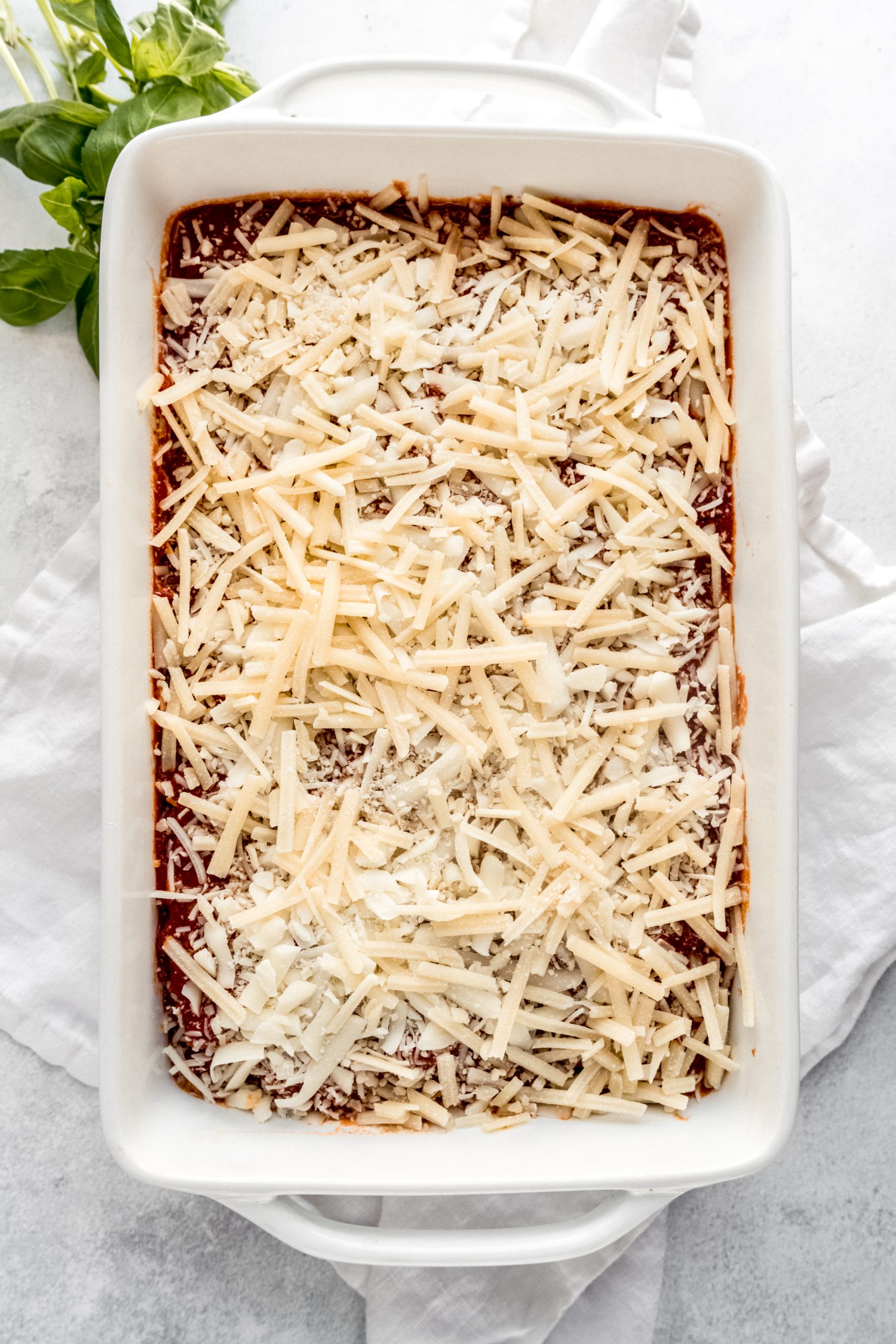 lasagna in baking dish before going into oven