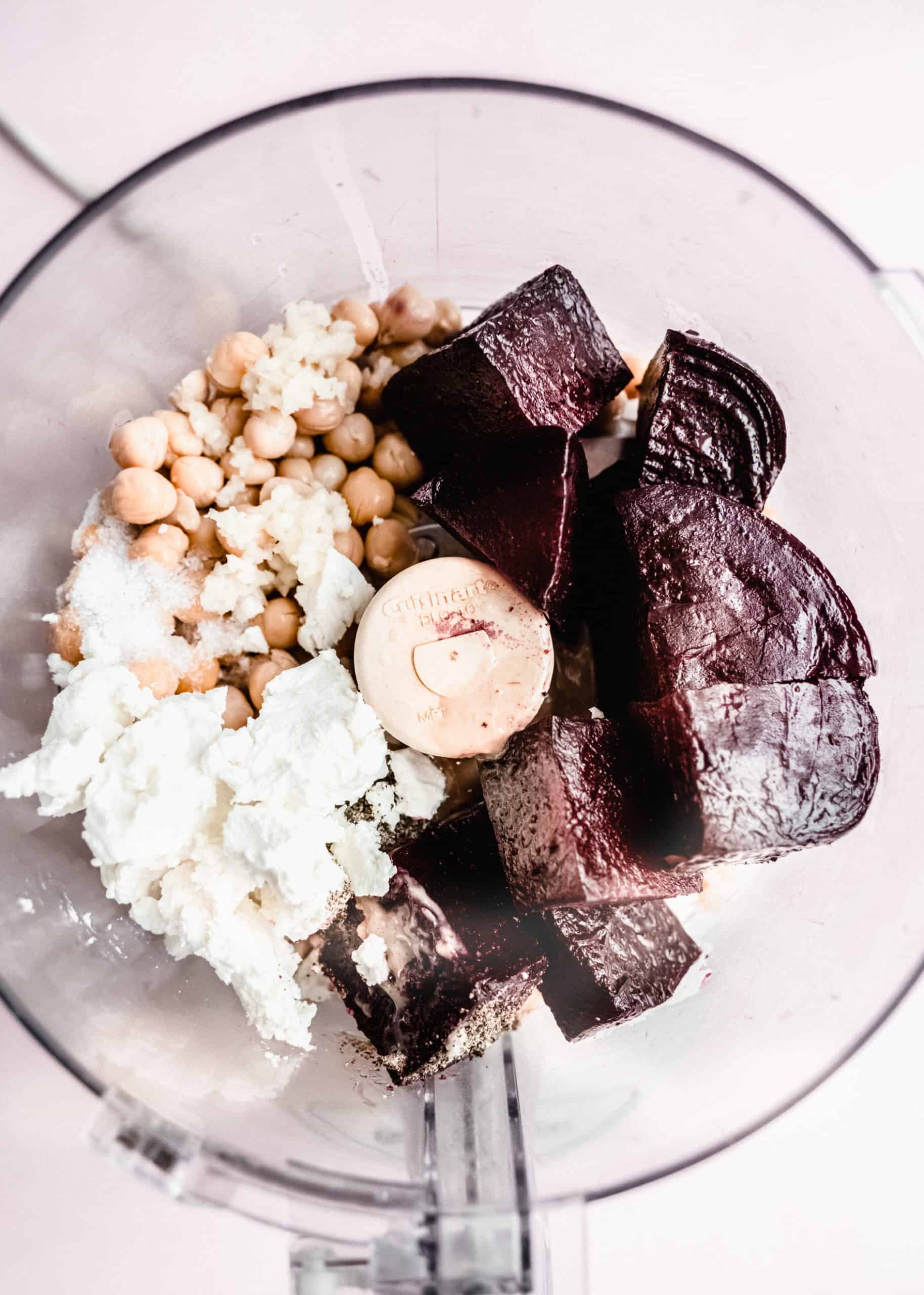 overhead shot of beet hummus ingredients in food processor