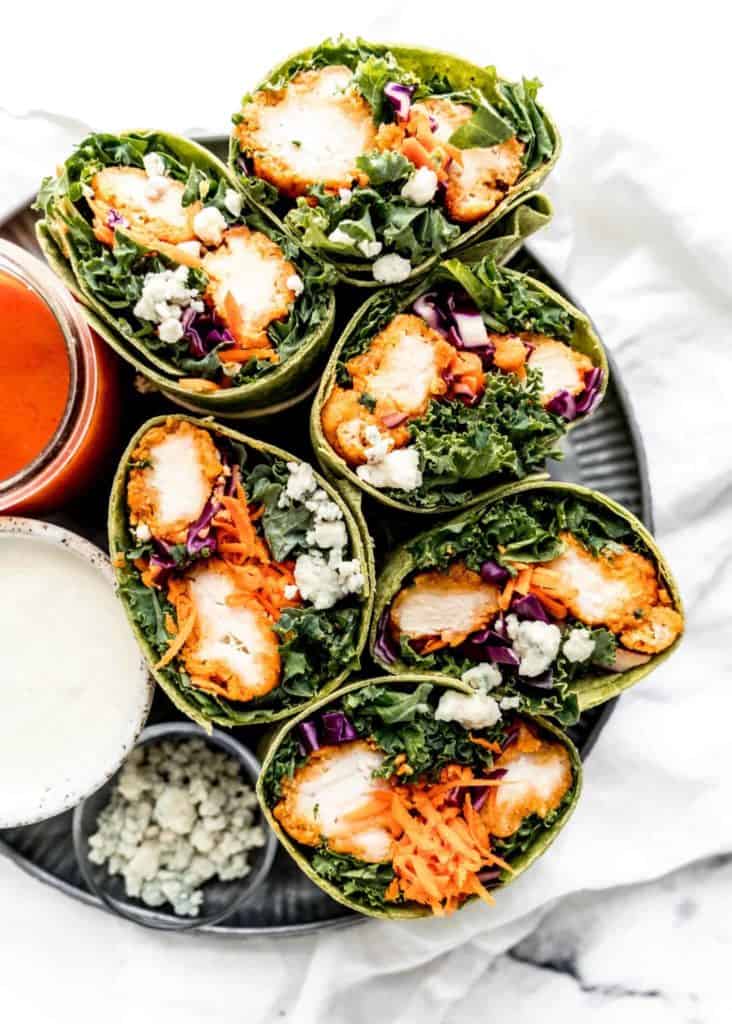 spicy buffalo chicken wraps cut in half facing cut side up